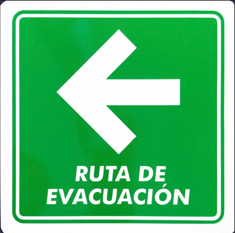 Señal fotoluminiscente indicando ruta de evacuación